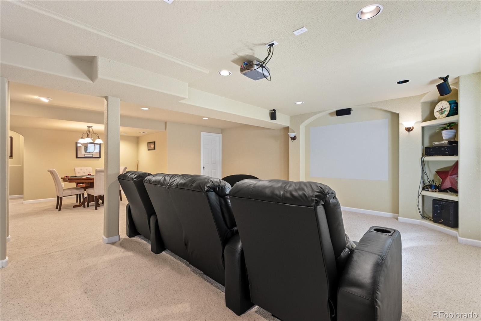 5126 Tuscany Court Highlands Ranch, CO 80130 - Photo 36 of 50 a living room with furniture and a flat screen tv