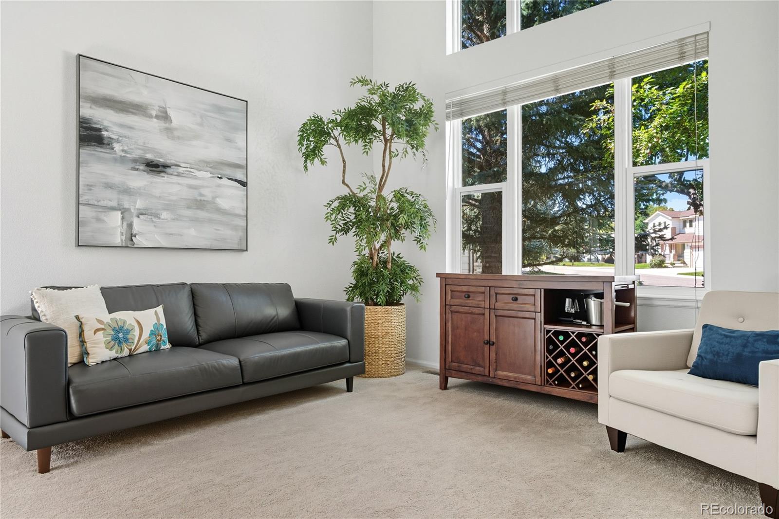 5126 Tuscany Court Highlands Ranch, CO 80130 - Photo 6 of 50 a living room with furniture and a potted plant