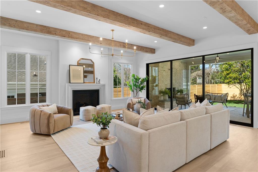1140 Rosedale Drive Northeast Atlanta, GA 30306 - Photo 16 of 41 a living room with furniture fireplace and large windows
