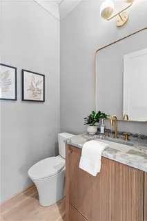 a bed room with a bed mirror and a window