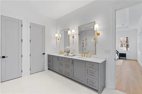 a bathroom with a bathtub and next to a window