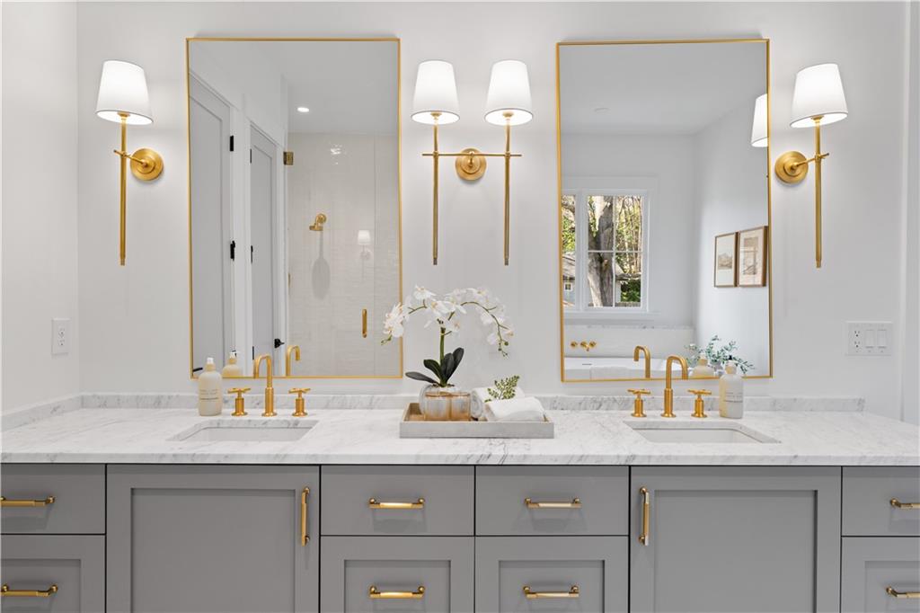 1140 Rosedale Drive Northeast Atlanta, GA 30306 - Photo 29 of 41 a bathroom with a granite countertop sink and a mirror
