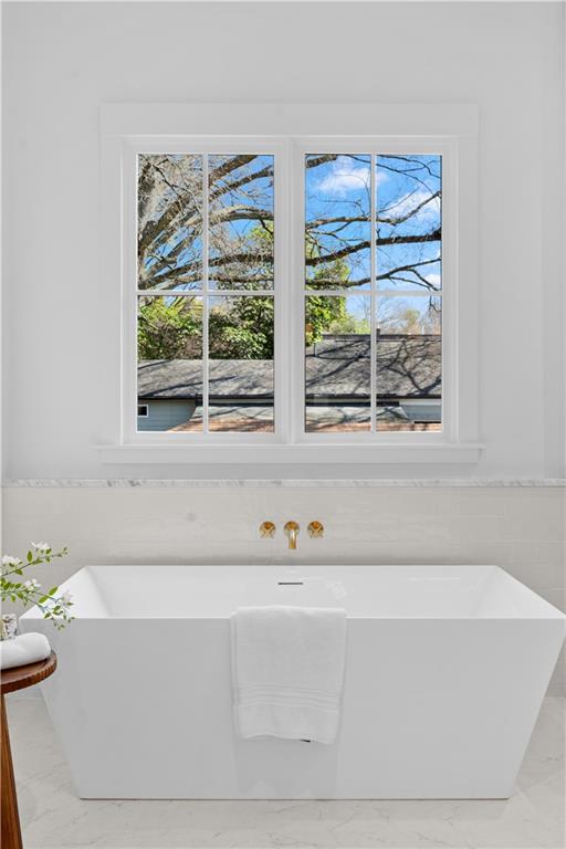 1140 Rosedale Drive Northeast Atlanta, GA 30306 - Photo 30 of 41 a bathroom with a bathtub and next to a window
