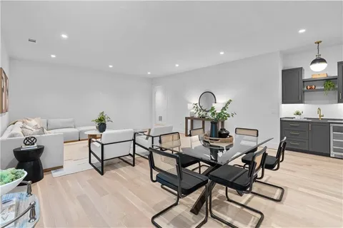 a dining room with furniture and window