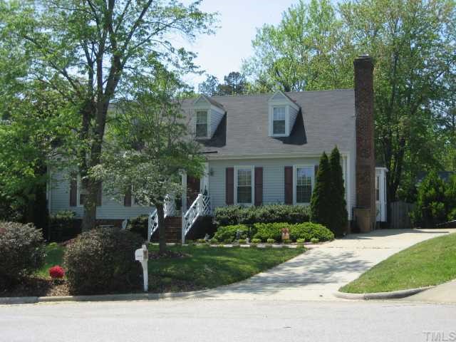 8605 Cheerful Court Raleigh, NC 27615 - Photo 1 of 12 a front view of a house with a garden