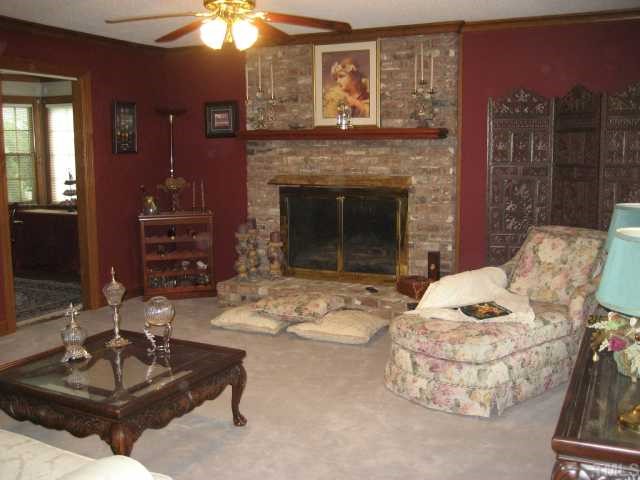 8605 Cheerful Court Raleigh, NC 27615 - Photo 2 of 12 a living room with furniture and a fireplace