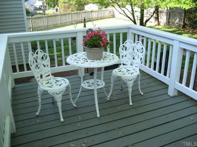 8605 Cheerful Court Raleigh, NC 27615 - Photo 10 of 12 a view of a dining tables and chairs in patio