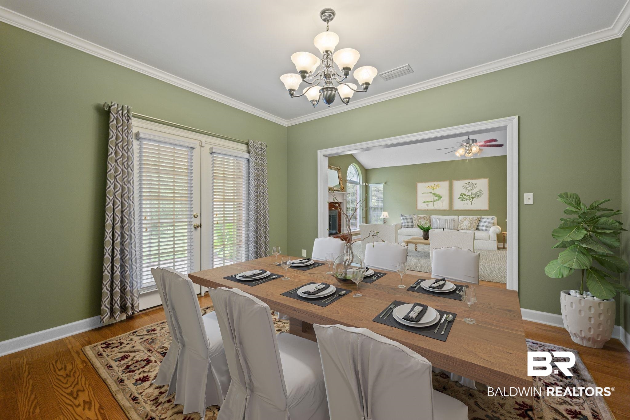 5618 Leytham Road Theodore, AL 36582 - Photo 15 of 60 Dining room featuring ornamental molding, ceiling fan with notable chandelier, and hardwood / wood-style floors