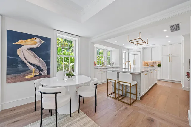 a kitchen with stainless steel appliances granite countertop a sink and a refrigerator