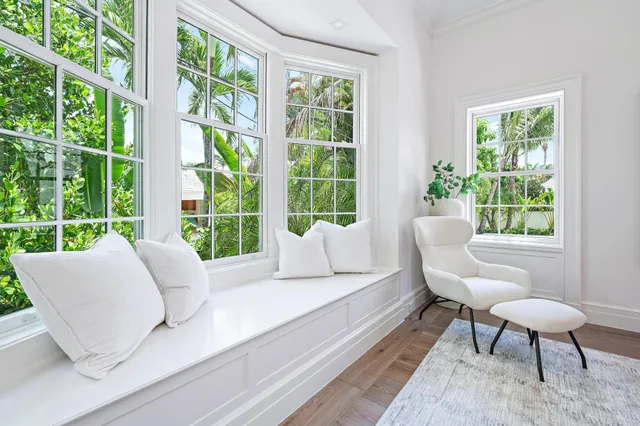 a bedroom with a bed and a chair