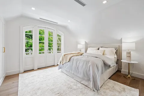 a bedroom with a bed and a cabinets