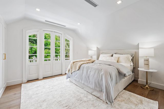 a bedroom with a bed and a cabinets