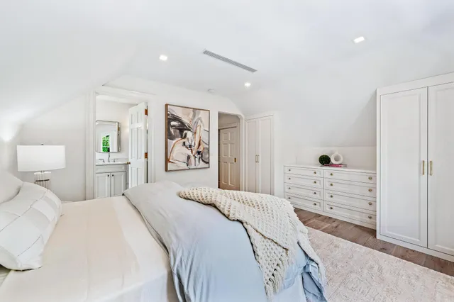 a bathroom with a shower sink and mirror