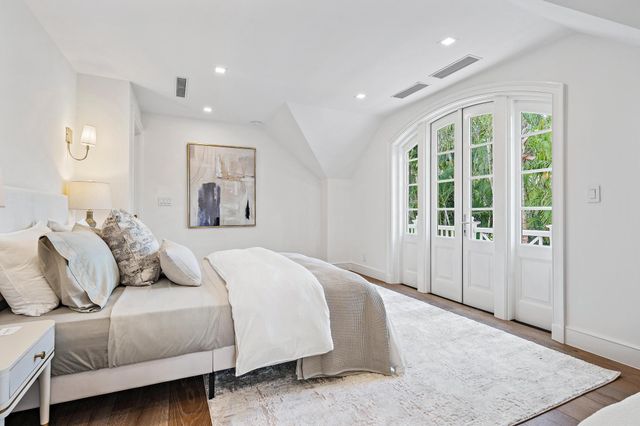 a en suite bathroom with a granite countertop sink mirror and shower