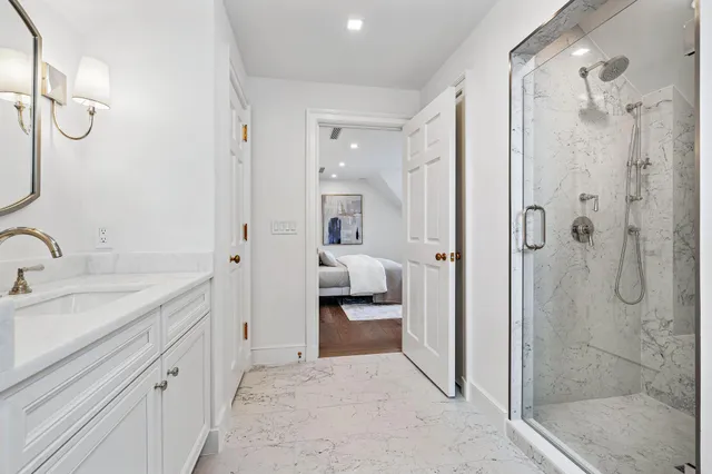 a en suite bathroom with double sink and a mirror