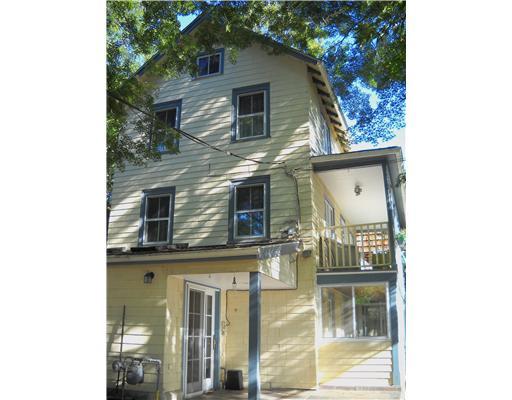 86 Ritch Avenue Greenwich, CT 06830 - Photo 2 of 13 a front view of a house with a yard