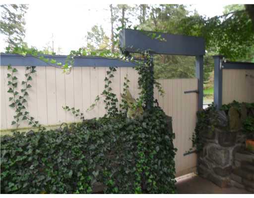 86 Ritch Avenue Greenwich, CT 06830 - Photo 3 of 13 a view of a house with a yard and garden