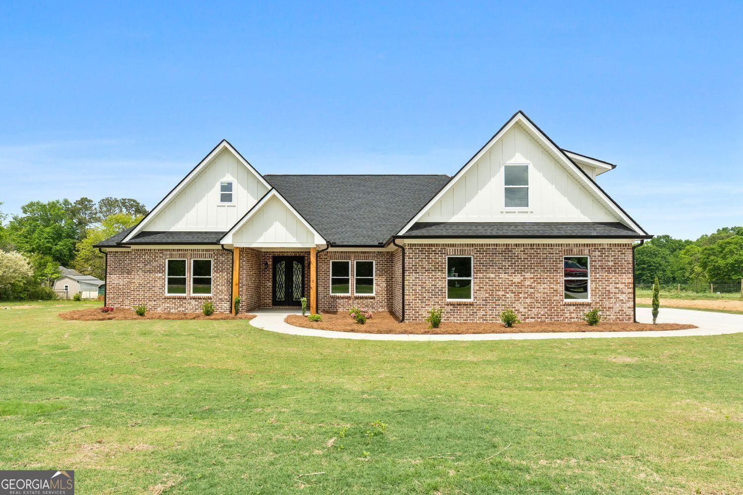 285 Rehoboth Church Road Griffin, GA 30224 - Photo 1 of 1 a front view of house with yard and green space