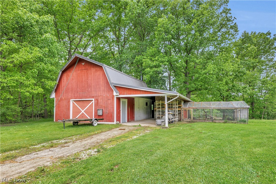 8704 Columbia Road Olmsted Falls, OH 44138 - Photo 31 of 34 red barn with attached chicken coop