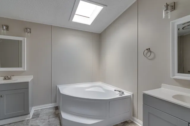 a bathroom with a sink and mirror