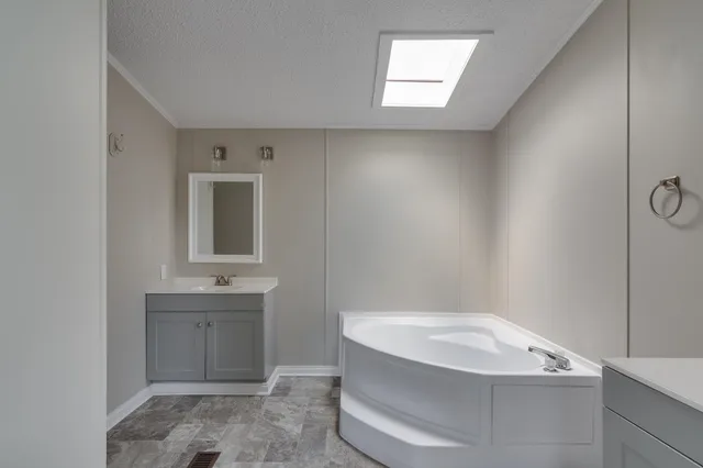 a bathroom with a bathtub and a sink