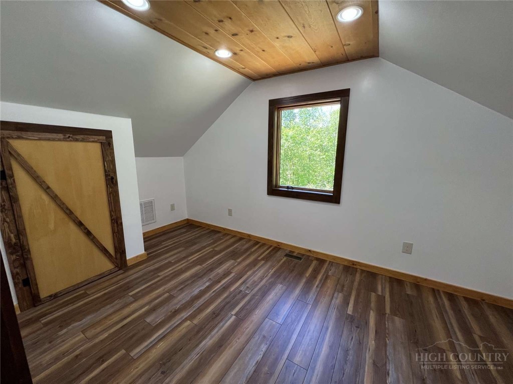 138 Talon Drive Boone, NC 28607 - Photo 18 of 25 a view of an empty room with wooden floor and a window