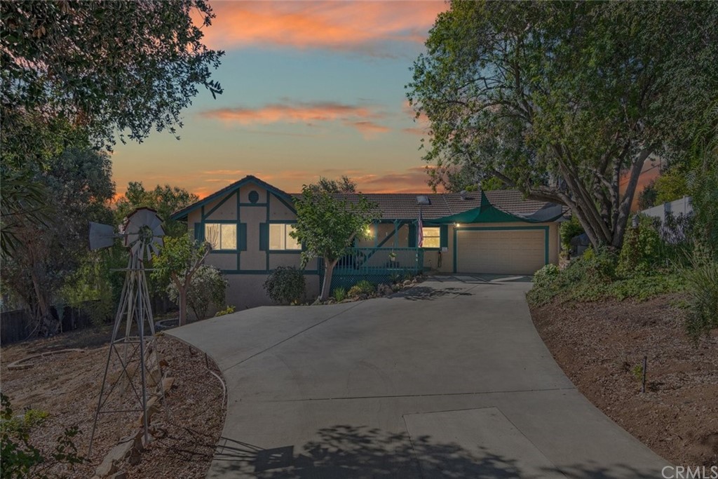 240 Ohearn Road Fallbrook, CA 92028 - Photo 1 of 1 a front view of a house with a yard and trees