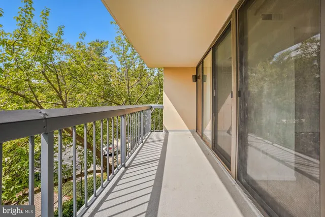 a view of balcony with wooden floor