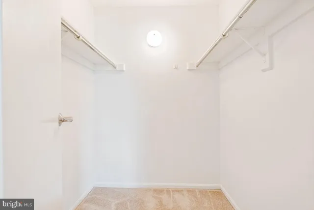 a bathroom with a granite countertop sink toilet a mirror a vanity and shower