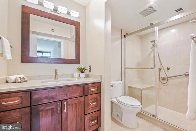 a bathroom with a glass shower door
