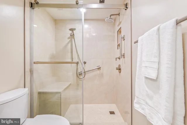a view of a storage & utility room with dryer and washer
