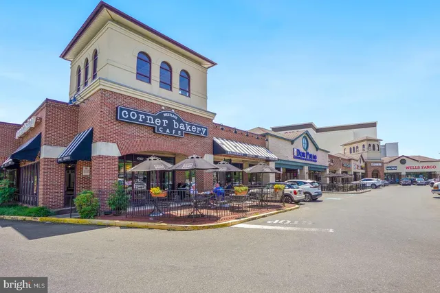 a view of a swimming pool with an outdoor space and seating area