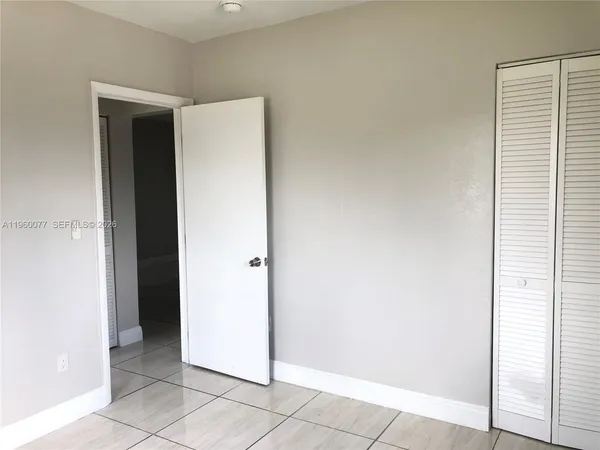 a view of a room that has a window in it