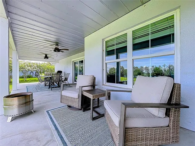 a view of a patio with a table chairs and a table