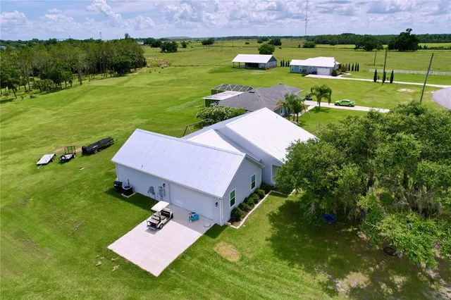 a front view of a house with a garden and yard