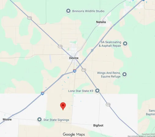 an empty room with wooden floor and cabinet