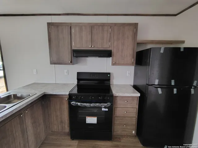 a white toilet sitting next to a shower