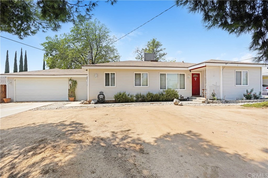 5480 Crest Avenue Riverside, CA 92503 - Photo 1 of 1 a front view of a house with a yard