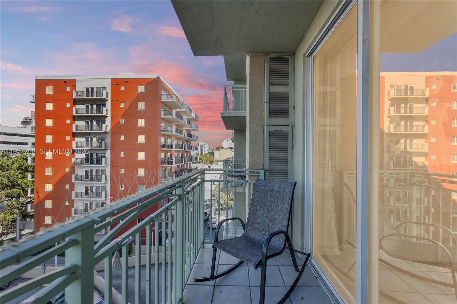 A private balcony offering stunning sunset views of the city skyline — the perfect spot to unwind at the end of the day with the warm South Florida sky as your backdrop.