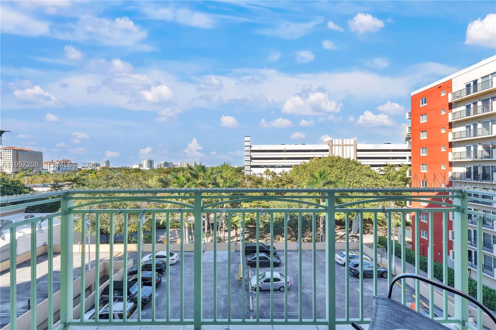 3500 Coral Way, Unit 710 Miami, FL 33145 - Photo 3 of 39 Private, sun-filled balcony offering vibrant urban views—the perfect spot for your morning coffee.