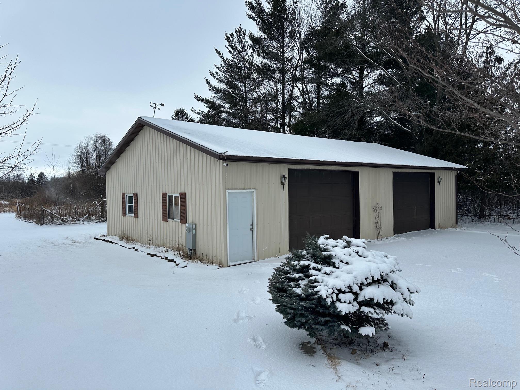 3803 Warner Road Cass City, MI 48726 - Photo 80 of 85 Snow covered garage featuring a detached garage