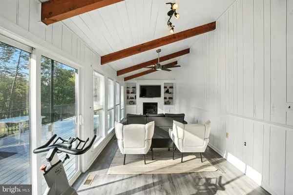 a bedroom with a bed and a ceiling fan