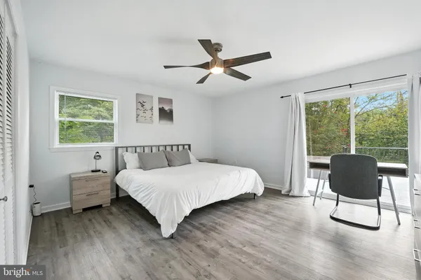 a bedroom with furniture and a window