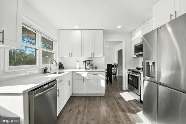 a view of a room with furniture window and wooden floor