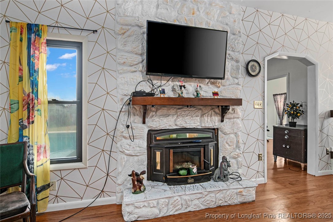 5978 Brookcliff Road Fayetteville, NC 28304 - Photo 17 of 38 a living room with furniture and a fireplace