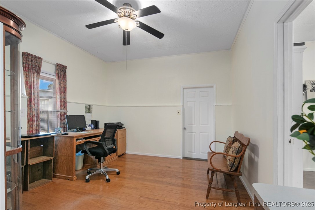 5978 Brookcliff Road Fayetteville, NC 28304 - Photo 21 of 38 a view of a workspace with furniture and a window