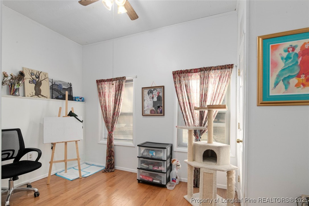 5978 Brookcliff Road Fayetteville, NC 28304 - Photo 22 of 38 a view of a workspace with furniture and a window