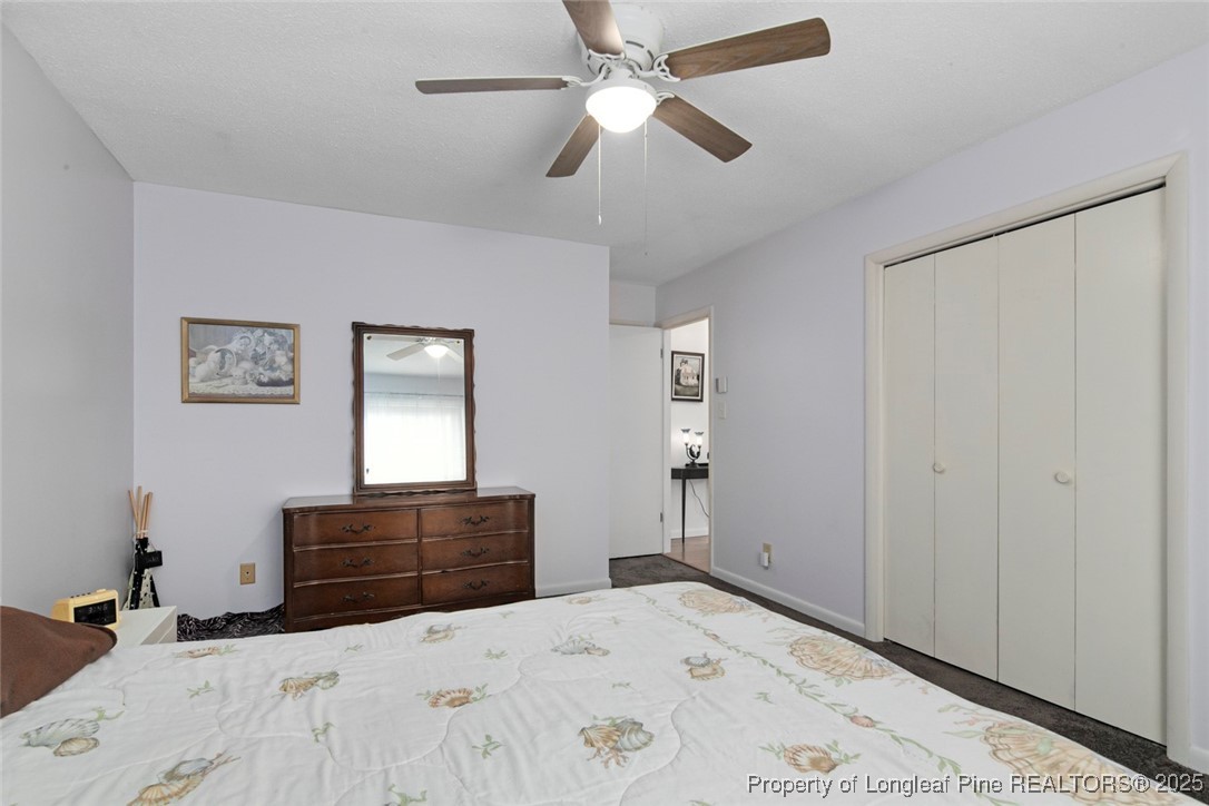 5978 Brookcliff Road Fayetteville, NC 28304 - Photo 27 of 38 a bedroom with a bed and a dresser