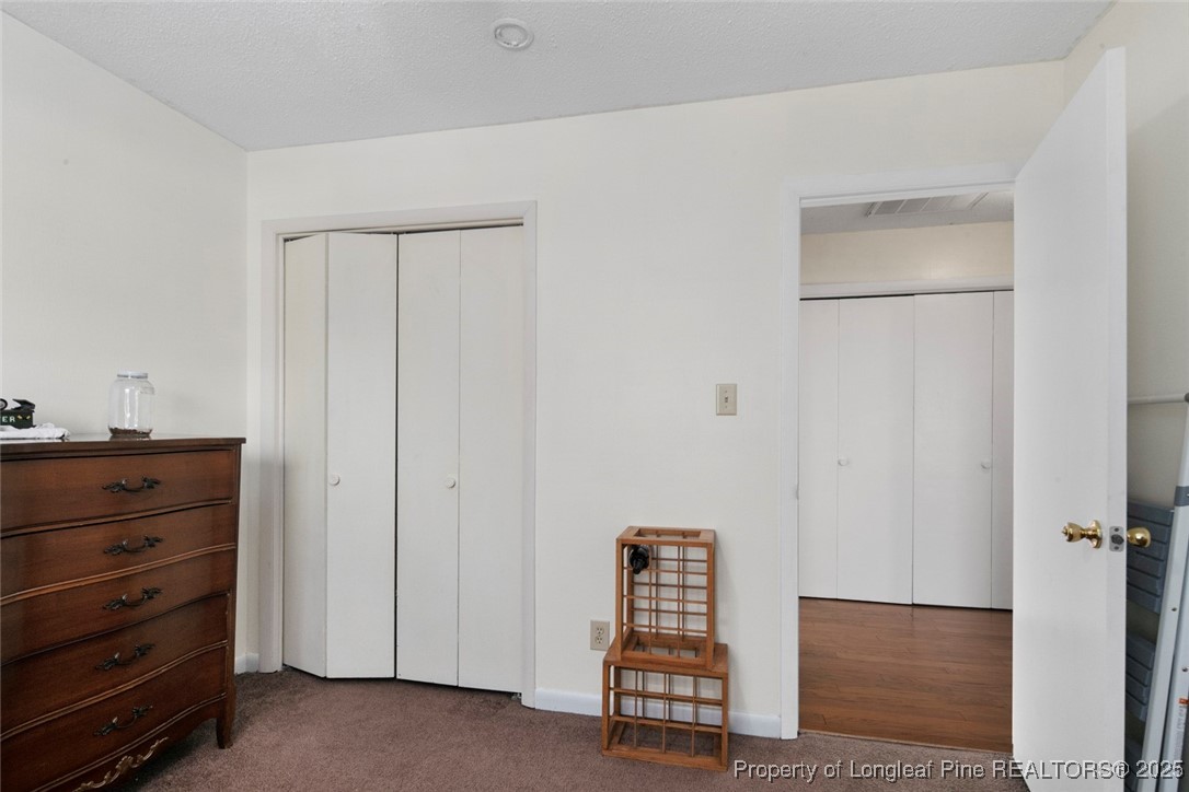 5978 Brookcliff Road Fayetteville, NC 28304 - Photo 29 of 38 a view of room with closet and mirror