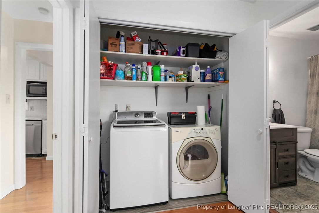 5978 Brookcliff Road Fayetteville, NC 28304 - Photo 32 of 38 a view of washer and dryer in a utility room